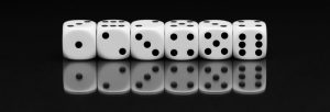 Image showing six dice in a line, numbered from 1-6, illustrating that Mathematics examinations can be a game of chance without the right preparation on a page for Maths the benefits of tuition